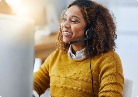 Virtual receptionist speaking to a customer through a headset.