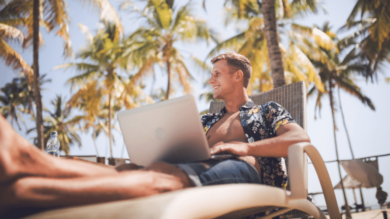 Small business owner working by the pool on vacation