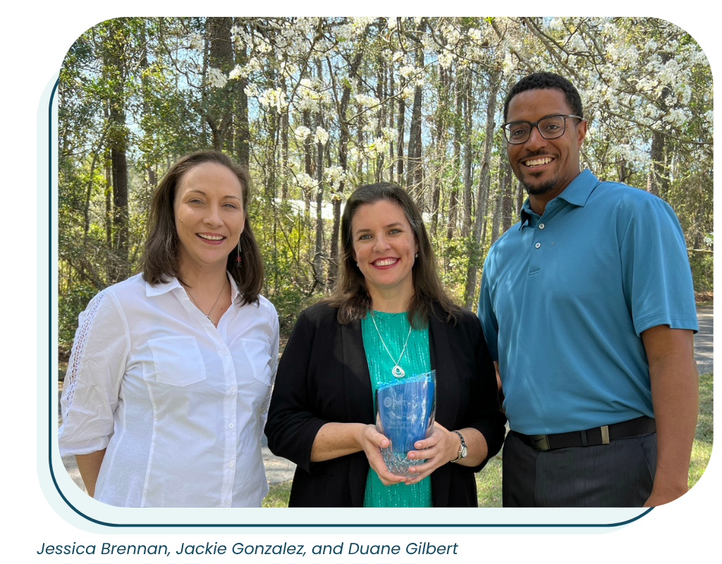 Jackie Gonzalez, CEO presents the Glen A. Davdison Legacy Award to the inaugural winners, Jessica Brennan and Duane Gilbert